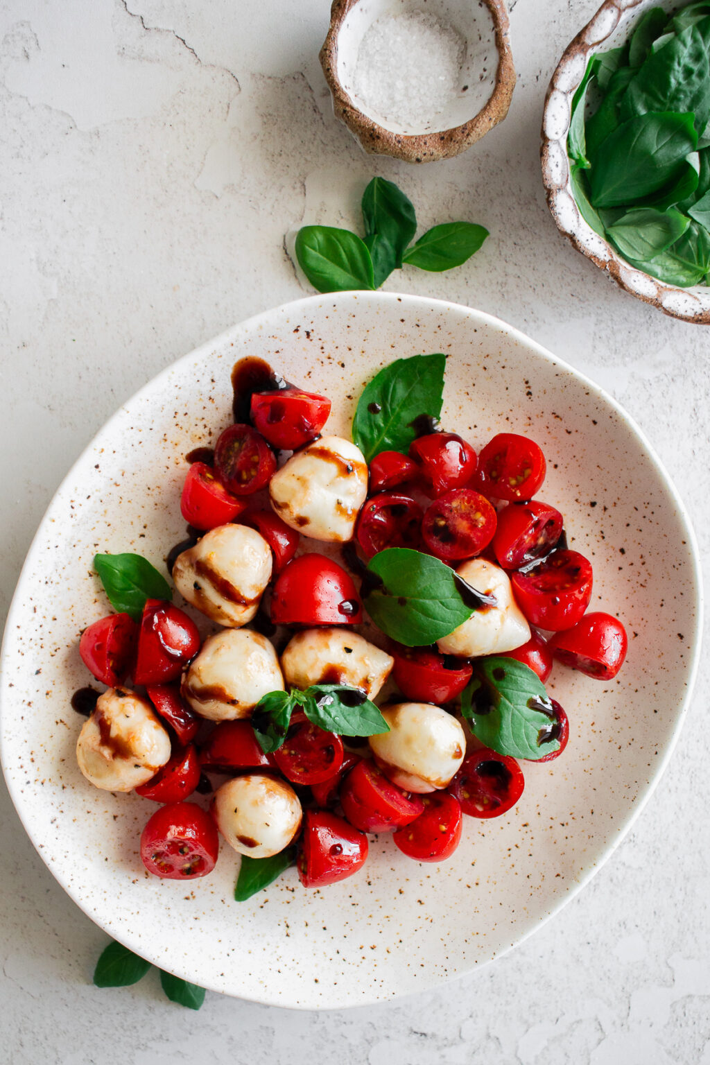 Caprese salad with cherry tomatoes fresh mozzarella basil balsamic glaze Italian classic fresh side