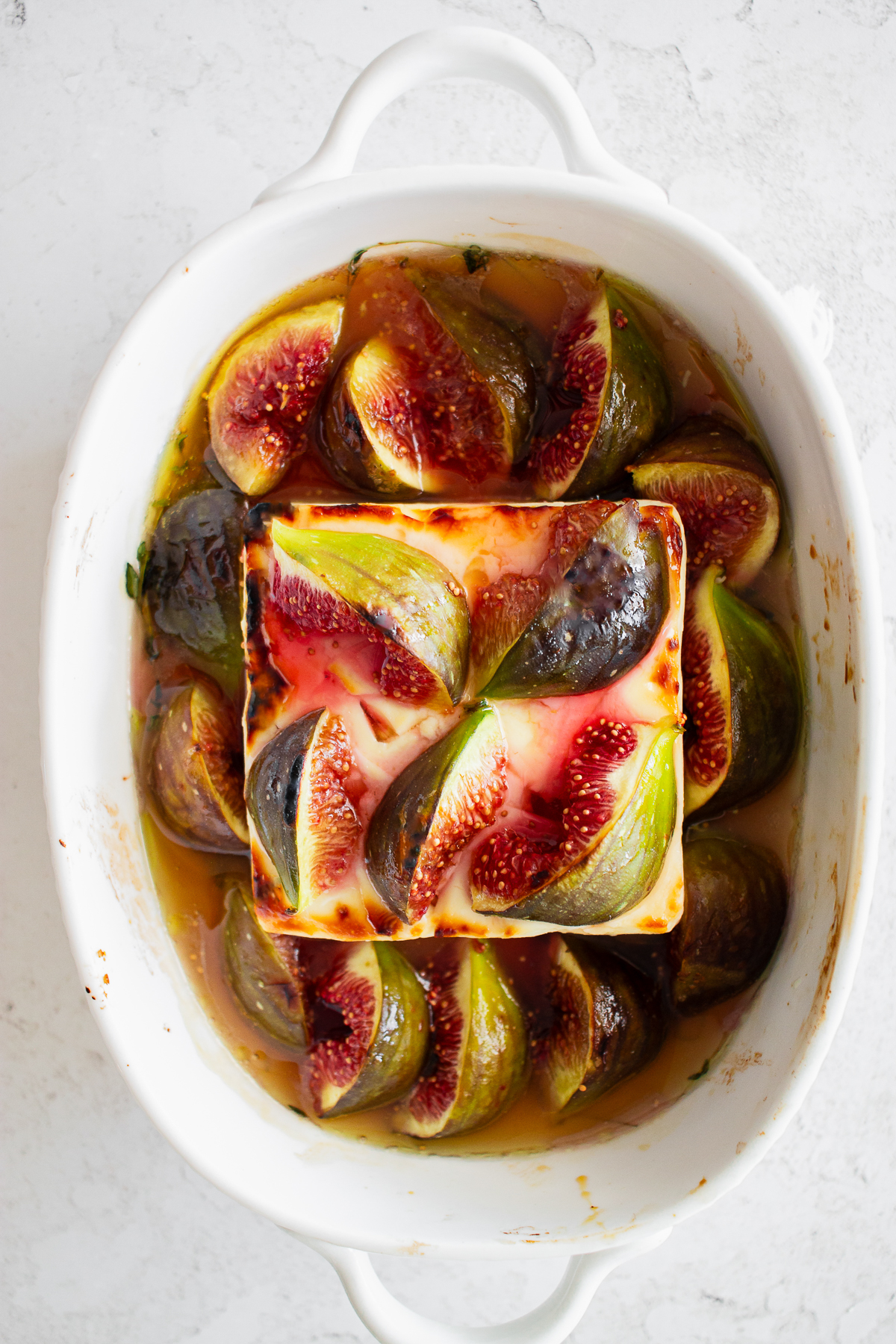 Baked feta recipe with figs and honey on top.