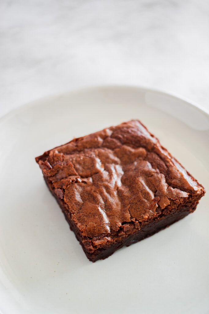 brownie square on a small white plate blog edit