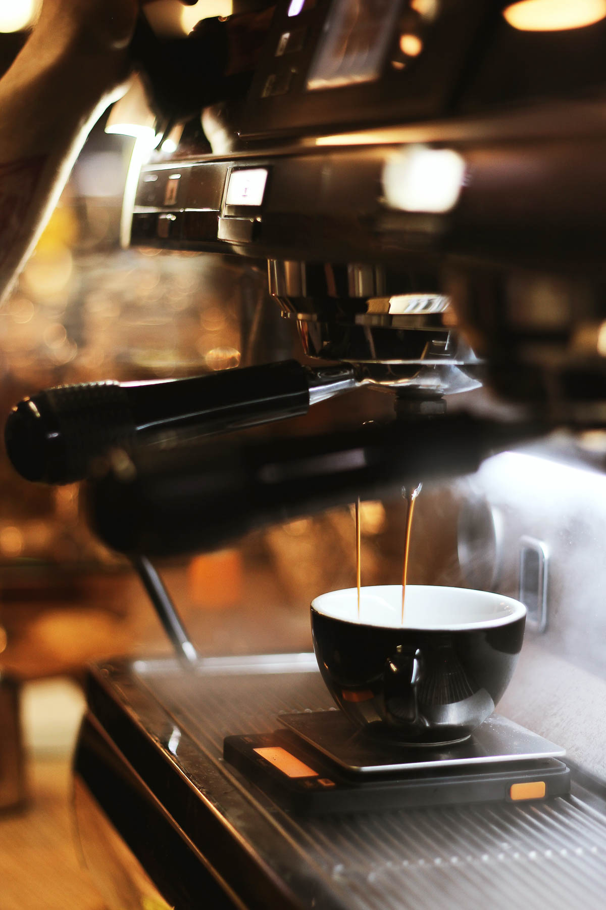 Espresso machine making espresso for latte.
